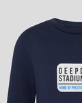Close-up of navy fabric and chest logo on junior street sign tee showing the graphic design