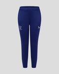 Junior blue training knit pants with a club crest on the left thigh and Castore logo on the right.