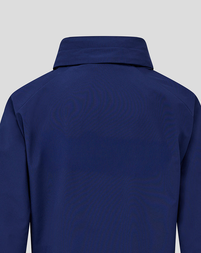 Back view of blue junior training packable hooded shower jacket with hood up.