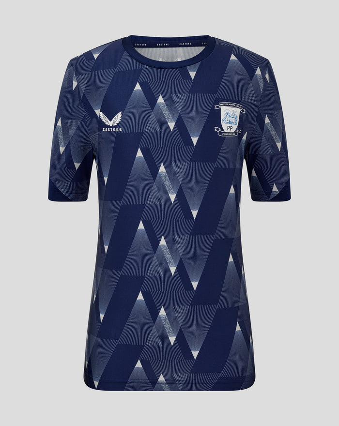 Front view of navy junior Preston North End matchday shirt with white geometric triangles and club crest on the chest