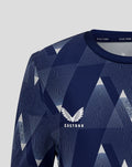 Close-up of navy Junior 25/26 Matchday shirt with geometric pattern and left chest crest.