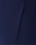 Close-up of navy fabric and seam lines on the Junior 25/26 matchday jacket.