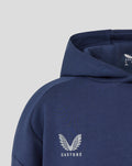 Close-up of navy hoodie chest area with Castore branding and wings logo.