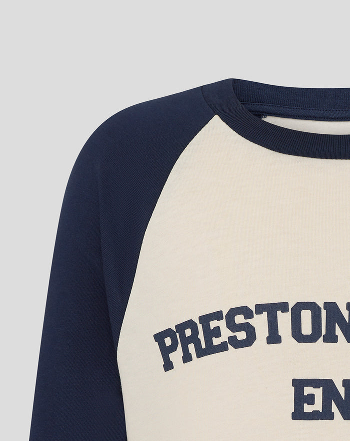 Close up of a navy raglan sleeve tee with beige front and Preston North End lettering across the chest