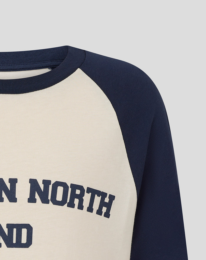 Neckline and shoulder view of a navy raglan tee with cream front and Preston North End lettering