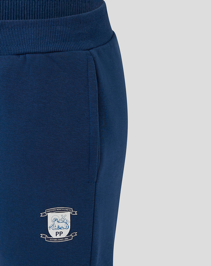 Close up of navy Men's Core Joggers showing ribbed waistband and Preston North End crest on left thigh