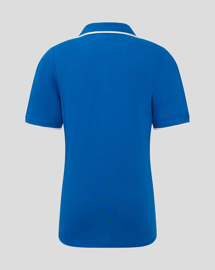 Back view of blue Junior Classic Polo shirt with white piping at collar and sleeve cuffs.