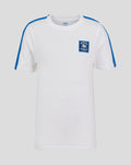 White cotton T shirt with blue shoulder stripes and a small blue crest on the left chest.