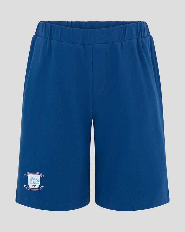 Junior blue shorts with elastic waistband and crest logo on the lower left leg