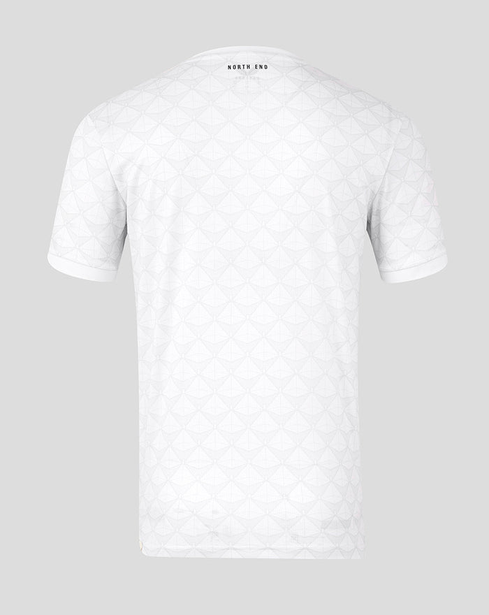 Back view of white junior home shirt with geometric pattern and Preston North End crest at upper back