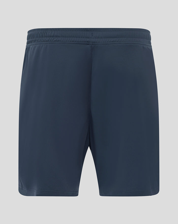 Back view of navy blue home goalkeeper shorts with an elastic waistband and a crest on the left leg.