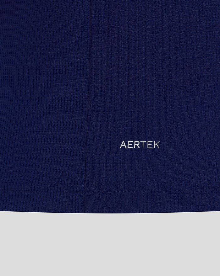 Close-up of navy blue fabric with AERTEK branding near the hem