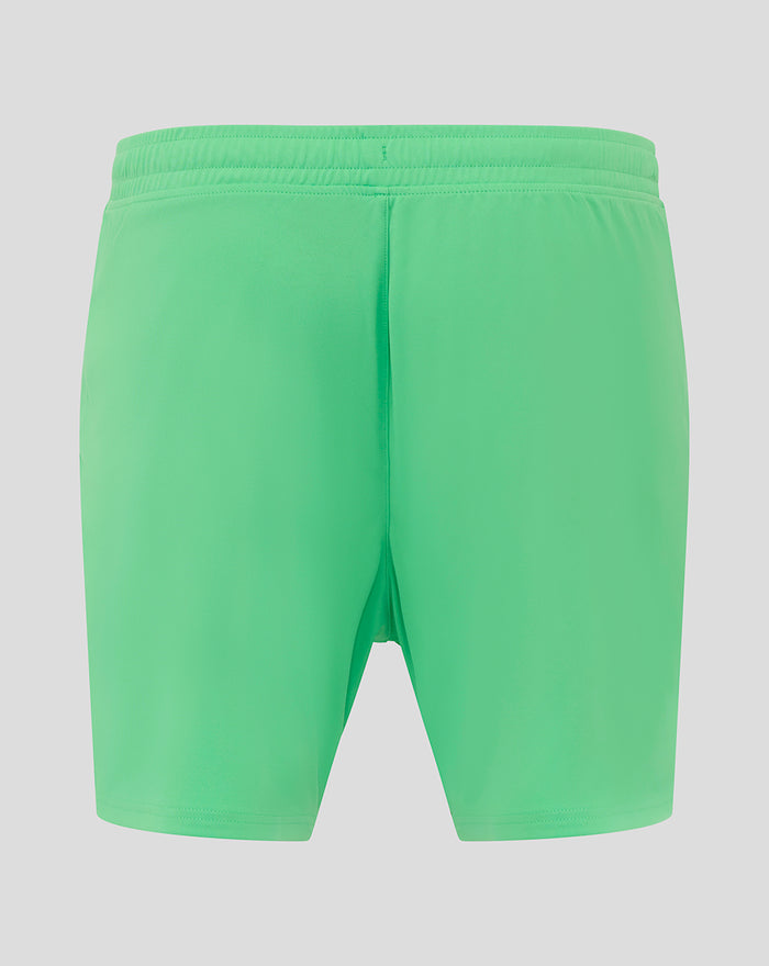 Back view of bright green men's away goalkeeper shorts with an elastic waistband.