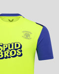 Close up of neon yellow Preston North End FC shirt showing crest on chest and Spud Bros branding