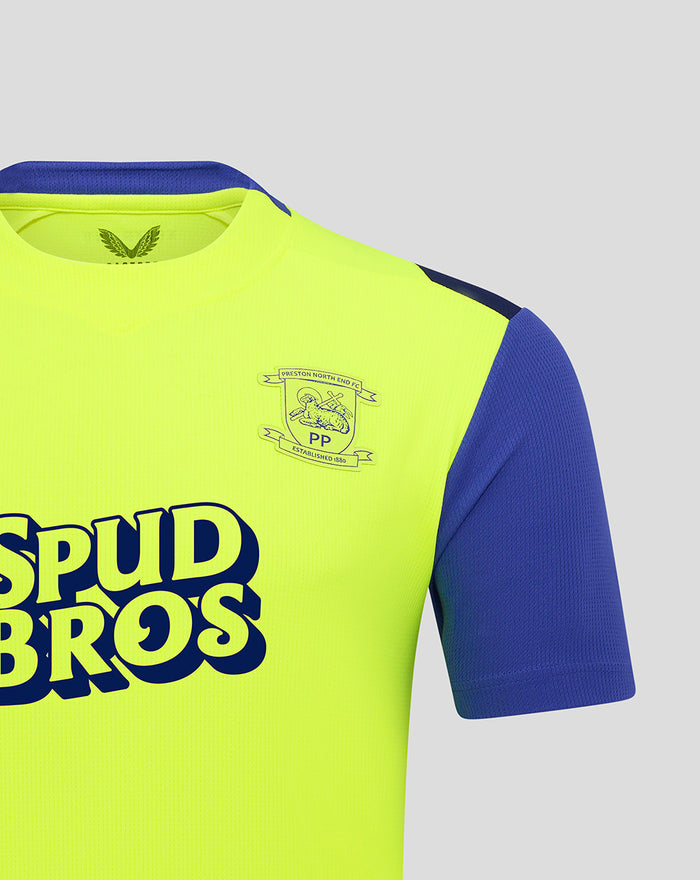 Close up of neon yellow Preston North End FC shirt showing crest on chest and Spud Bros branding