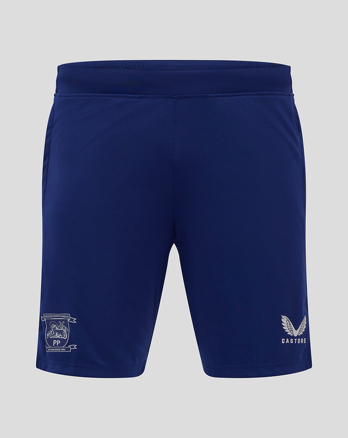 Back view of navy junior training knit shorts with club crest on the left leg and Castore logo on the right hem.