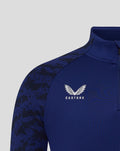 Blue men's training midlayer close up with Castore logo and club crest on the chest