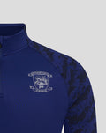 Blue training midlayer with club crest on the left chest and Castore logo on the right