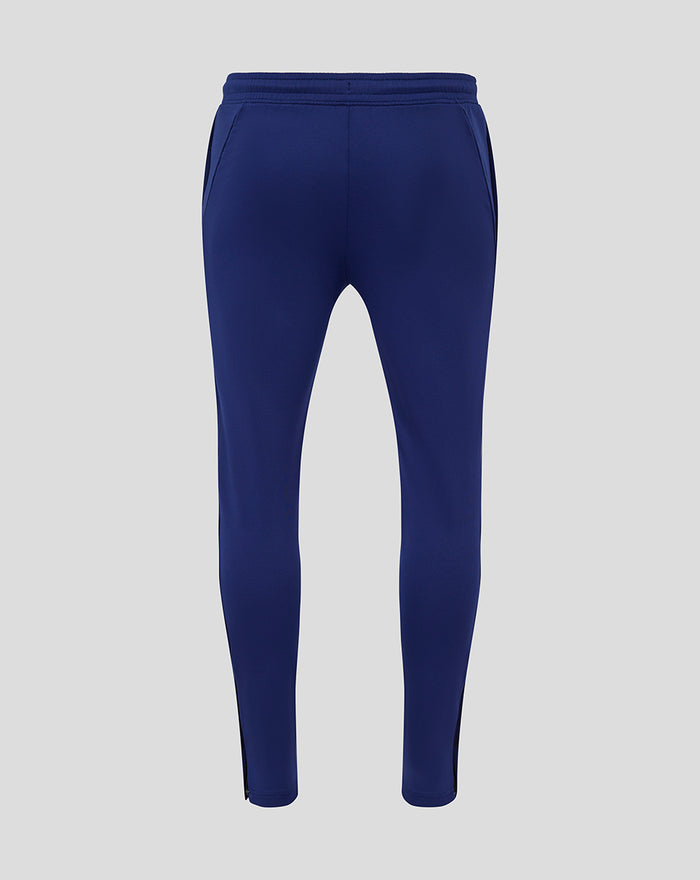 Back view of men's navy training knit pants with an elastic waistband