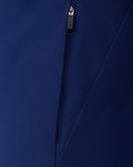 Close up of center front zipper on navy packable shower jacket with textured fabric