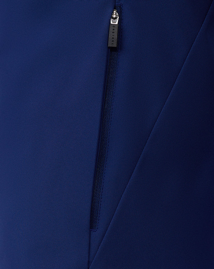 Close up of center front zipper on navy packable shower jacket with textured fabric