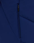 Close up of navy training gilet center front zipper against smooth fabric.