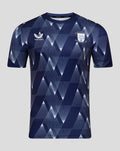 Front view of navy Preston North End Matchday Shirt with geometric pattern, Castore logo on left chest and club crest on right chest.
