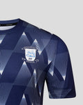 Front close-up of navy Preston North End matchday shirt with bold geometric print and crest on the chest