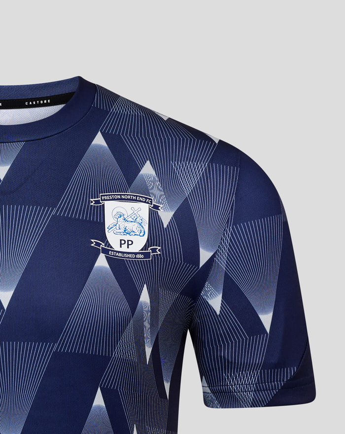 Front close-up of navy Preston North End matchday shirt with bold geometric print and crest on the chest