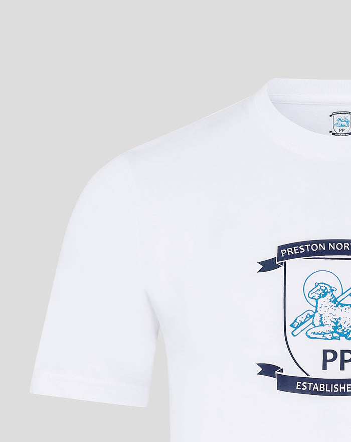 Close-up of white Crest T-shirt showing navy shield logo on the chest