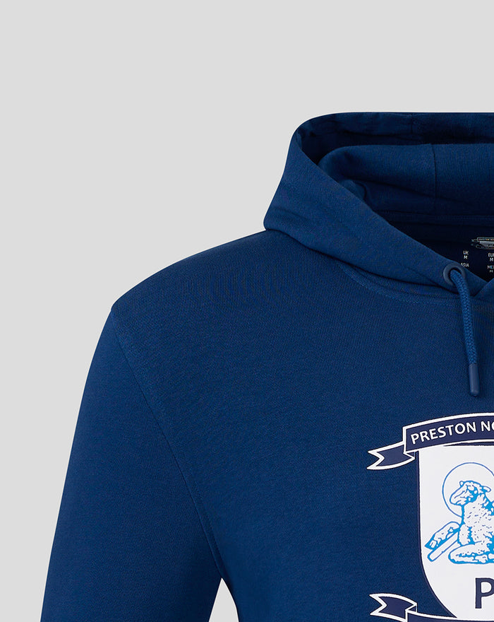 Close-up of navy hoodie showing hood and front crest on chest