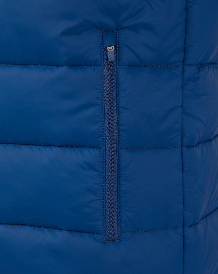 Close-up of vertical center zipper on navy core gilet with stitched panels