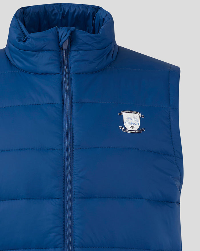Close-up of navy men's core gilet showing quilted padding and chest crest emblem with front zip