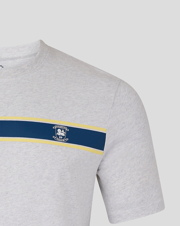 Close up of grey T shirt showing navy and yellow chest stripe with left chest crest