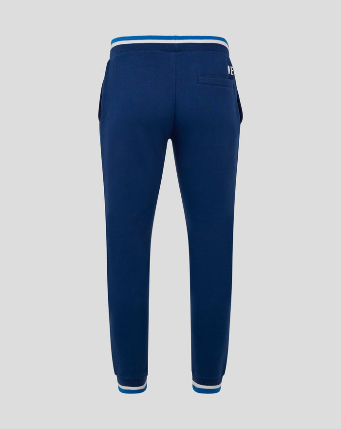 Rear view of navy joggers with striped rib waistband back pocket and left thigh woven badge