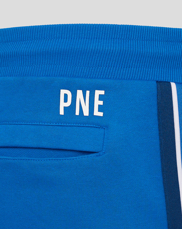 Close-up of blue shorts waistband with PNE lettering and a white side stripe
