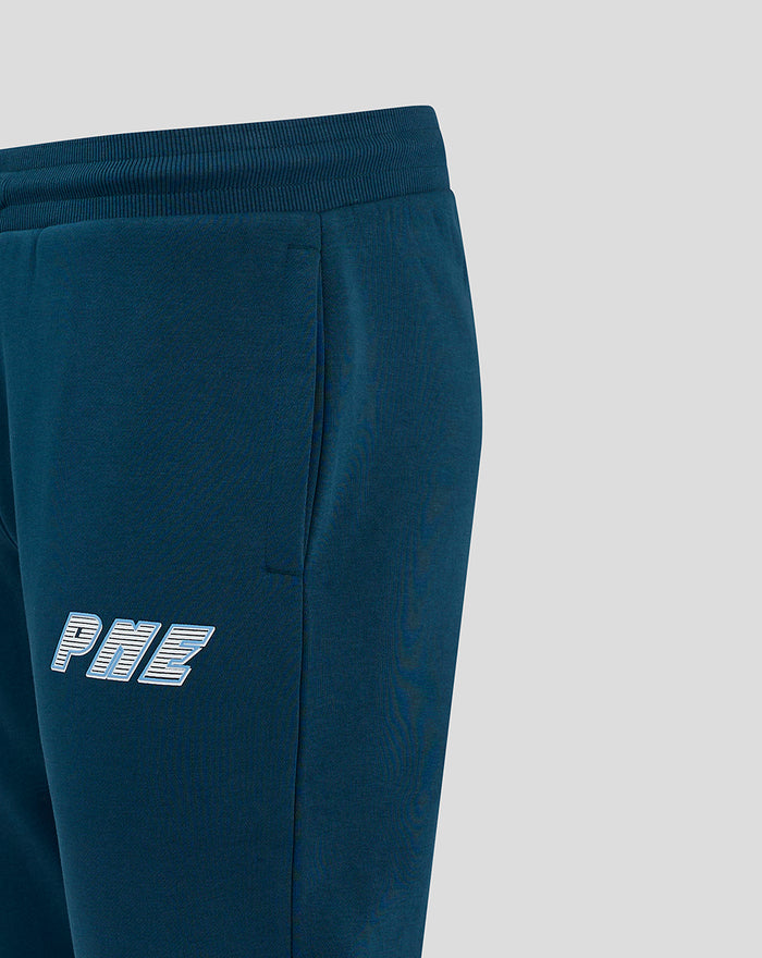 Close up of dark blue joggers showing side pocket and white PNE logo on the thigh