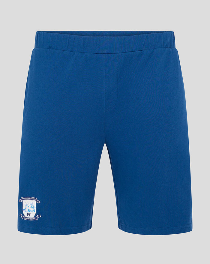 Blue plaid pajama shorts with crest emblem on the lower left