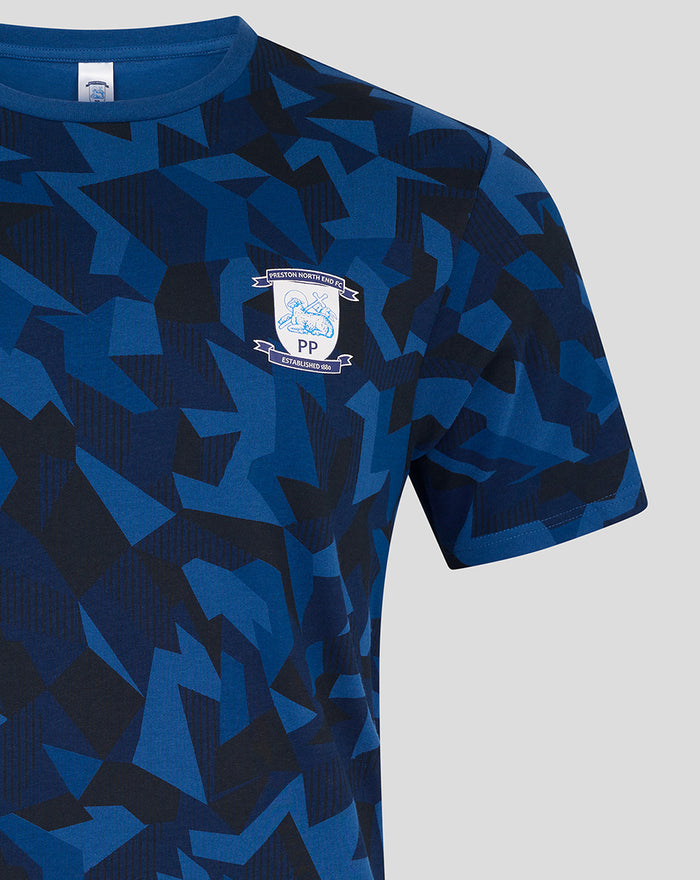 Men's short sleeve pajama top in blue geometric print with crest emblem on chest.