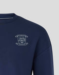Close-up of the navy Preston North End FC crest on the left chest of the travel crew sweatshirt.