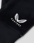 Detail view of black glove fabric with a white wing logo and CASTORE branding.