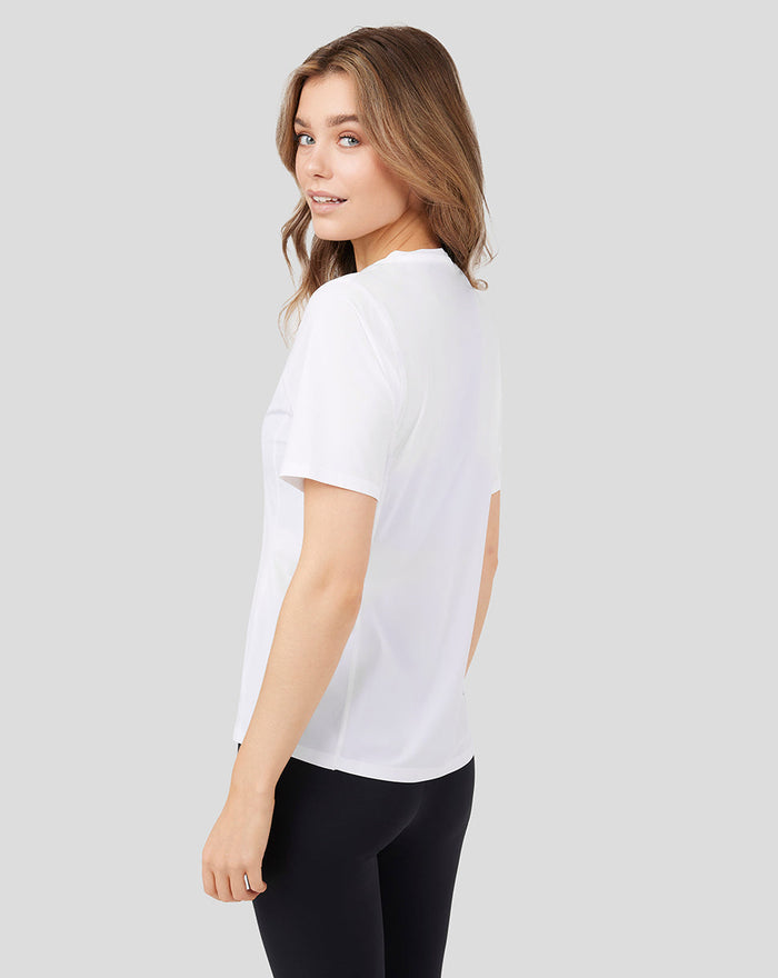 Side view of a woman wearing a white Women's Metatek Training T Shirt.