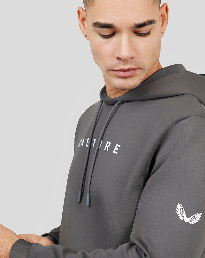 Close up of gray Magnet Ore Capsule Scuba Hoodie 3.0 on a male model showing hood strings and CASTORE branding.