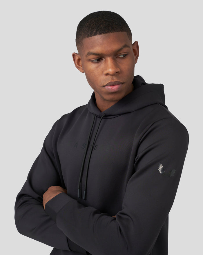 Male model in black Onyx scuba hoodie 3.0 with drawstrings against a light gray backdrop