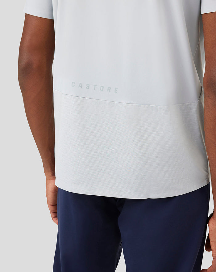Back view of Mist Metatek Training T Shirt in light gray with mesh lower back panel and Castore branding