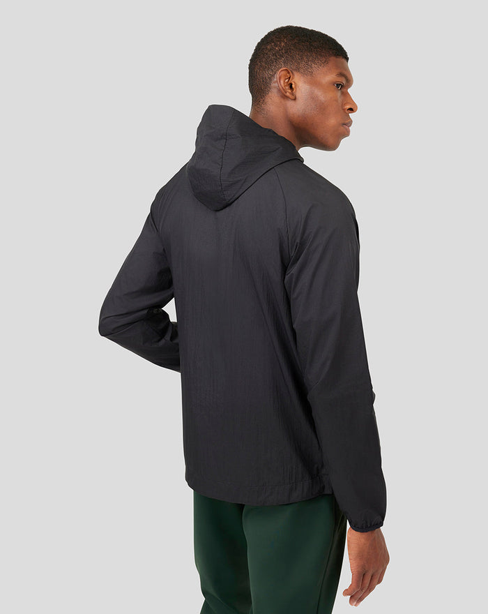 Back view of Onyx Metatek Flyweight Jacket in dark color with attached hood and clean silhouette