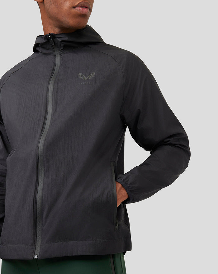Close-up view of black Onyx Metatek Flyweight Jacket showing front zipper and chest logo