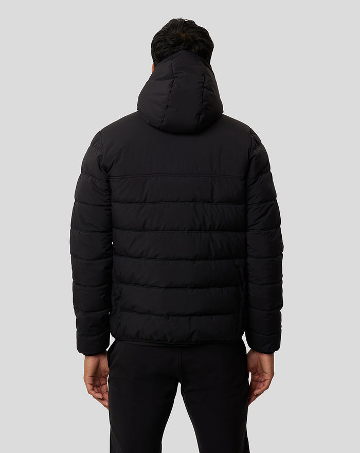 Back view of a man wearing a black Onyx Protek Insulated Jacket with hood and horizontal quilting