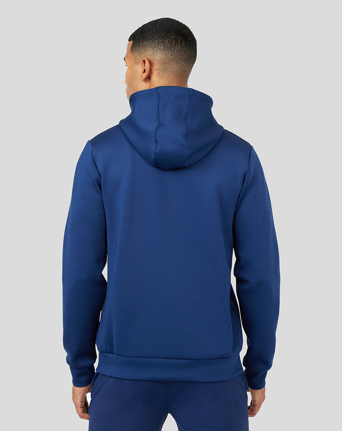 Back view of a male model in a blue Peacoat Scuba Zip Through Hoodie with hood up and clean silhouette