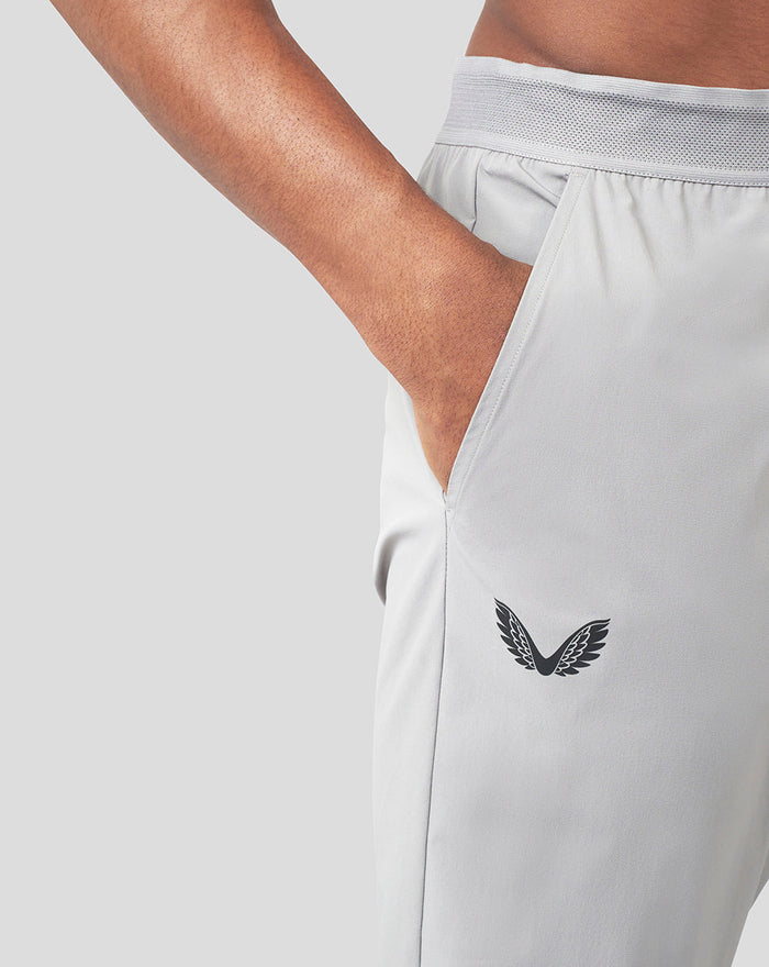 Light gray Slate Carbon Capsule woven joggers with side entry pocket and small wing logo on the thigh